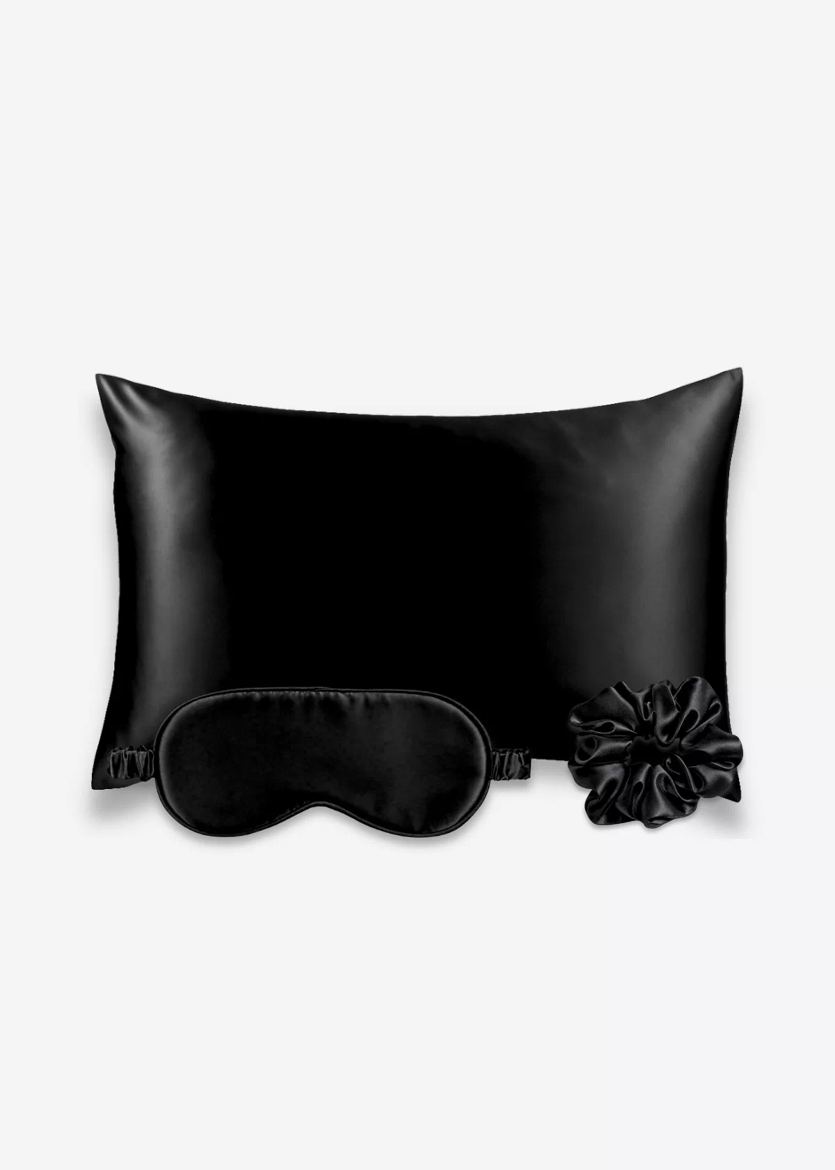 Coffret Les Essentiels : taie d’oreiller, masque de nuit classique et grand chouchou, tous en soie noire.